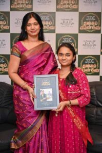 Radhika JA receiving award