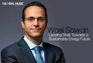 Portrait of a businessman in a dark suit and blue tie, with the headline 'Leading Shell Towards a Sustainable Energy Future' and The Global Hues logo area in the corner.