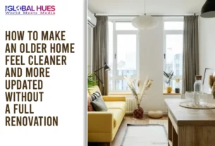 Bright living room with a yellow sofa, plants, and large windows; article title: How to make an older home feel cleaner and more updated without a full renovation.